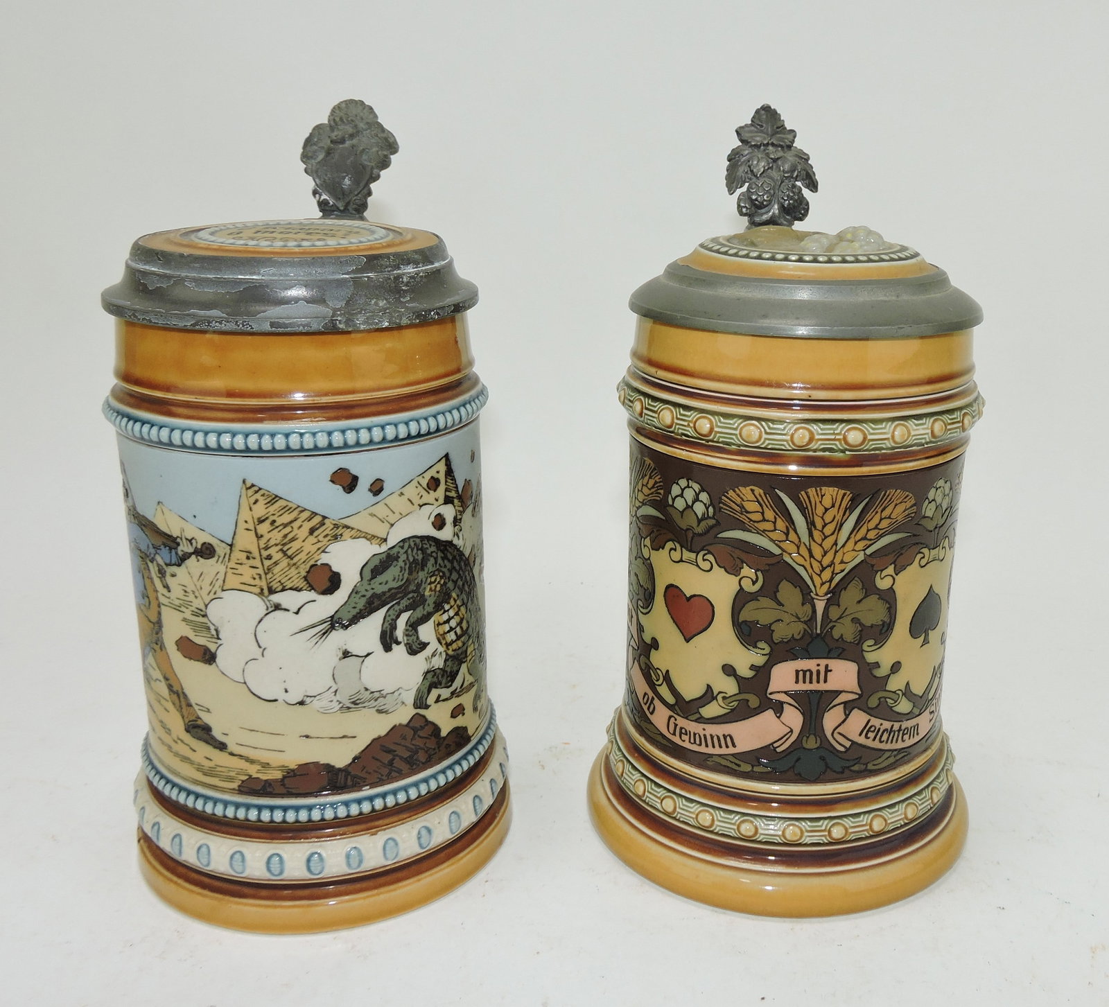 Mettlach lot of 2 steins, #1132 1/2L,: fiddler with crocodile AND #1395 1/2L, suites of cards