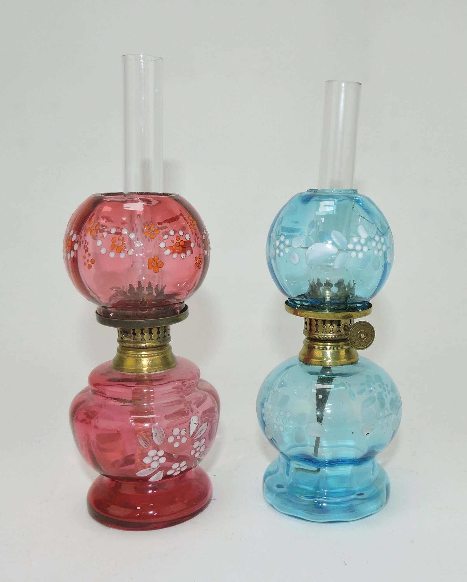 Cranberry and blue floral enamel: pair of miniature lamps, 5", damage to blue shade