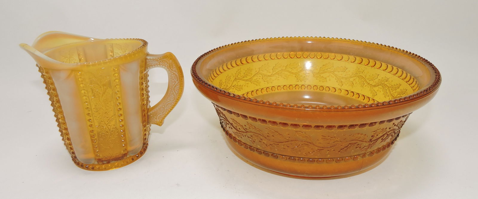 Greentown Holly amber 8 1/2" berry: bowl (minor rim nicks) and creamer (hairline)