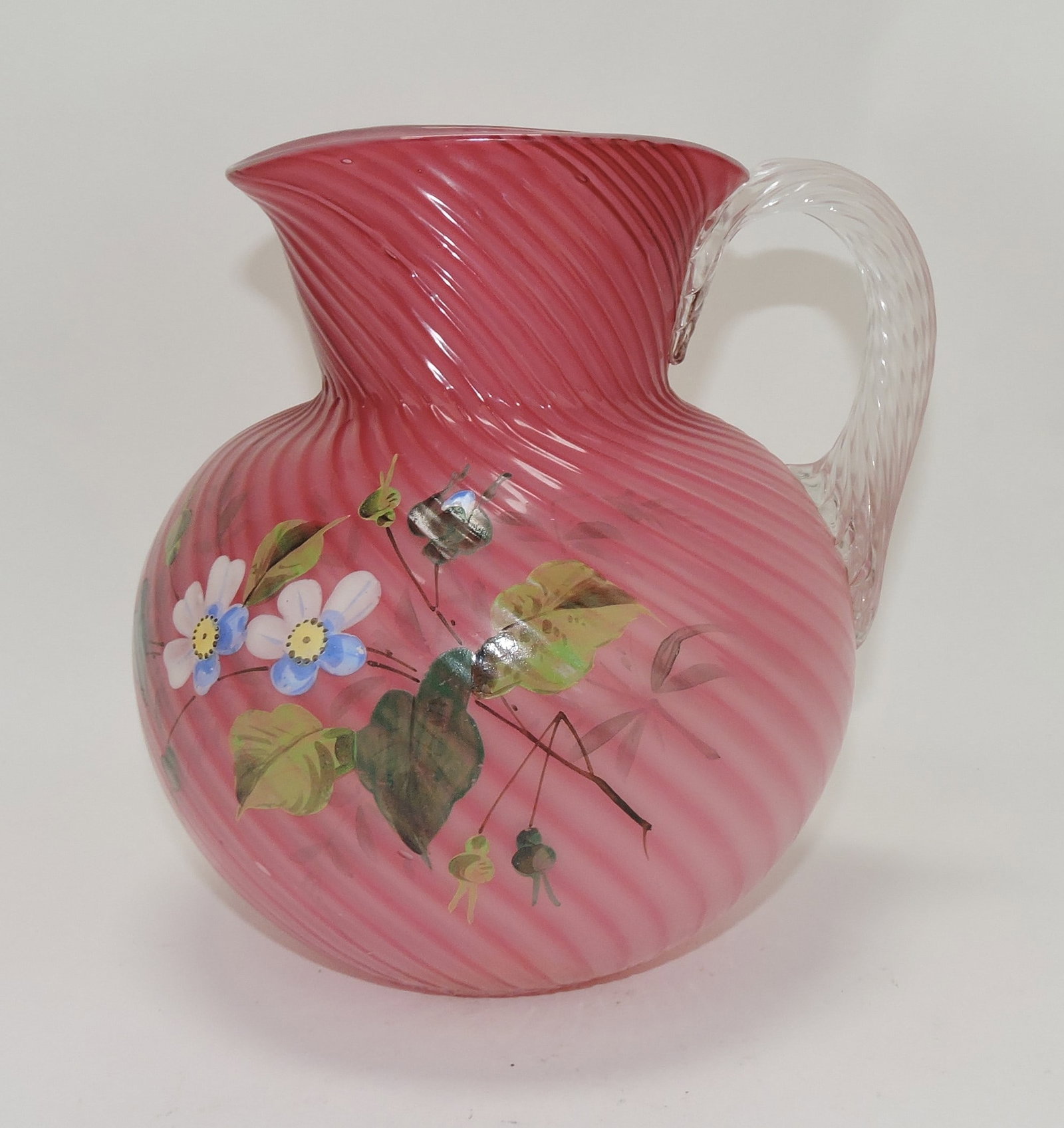 Duncan cranberry cased glass swirl: pitcher with floral enamel, 8"