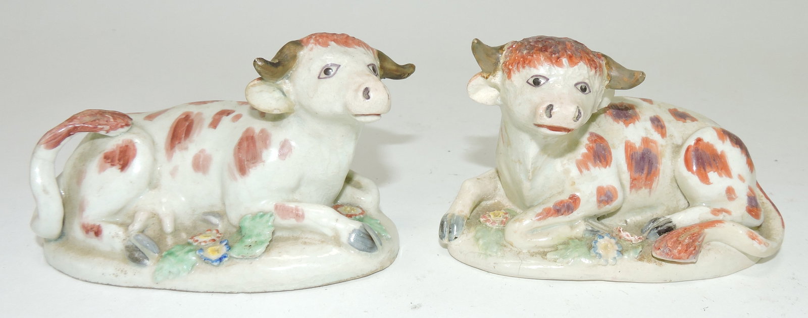 Staffordshire Pearlware pair of early: cow figures, 2 1/4"h, 4"l, repairs