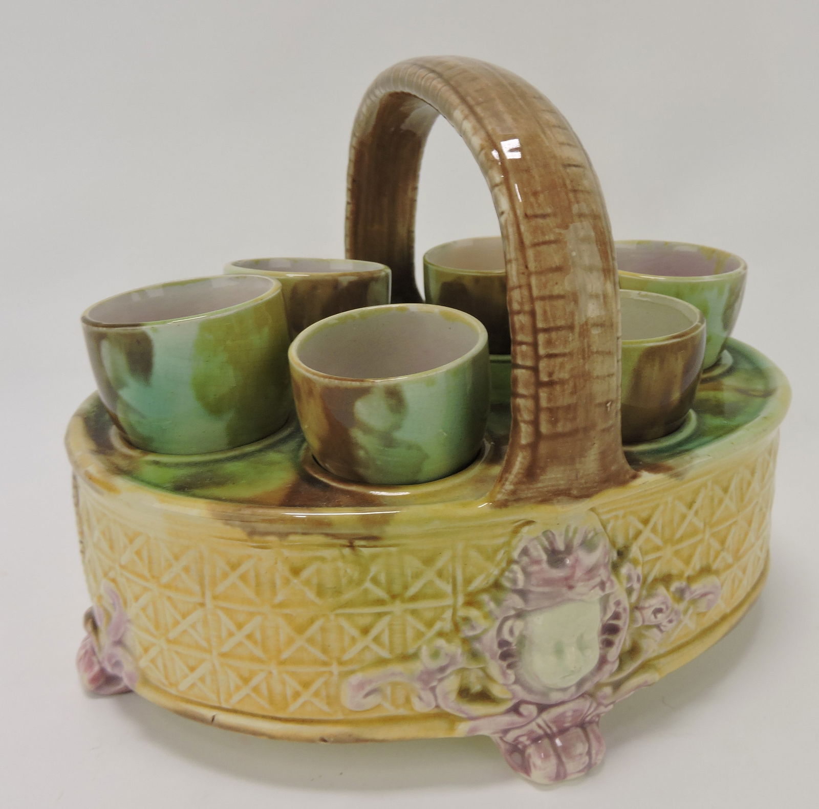 Majolica egg cup basket with 6 egg cups: .