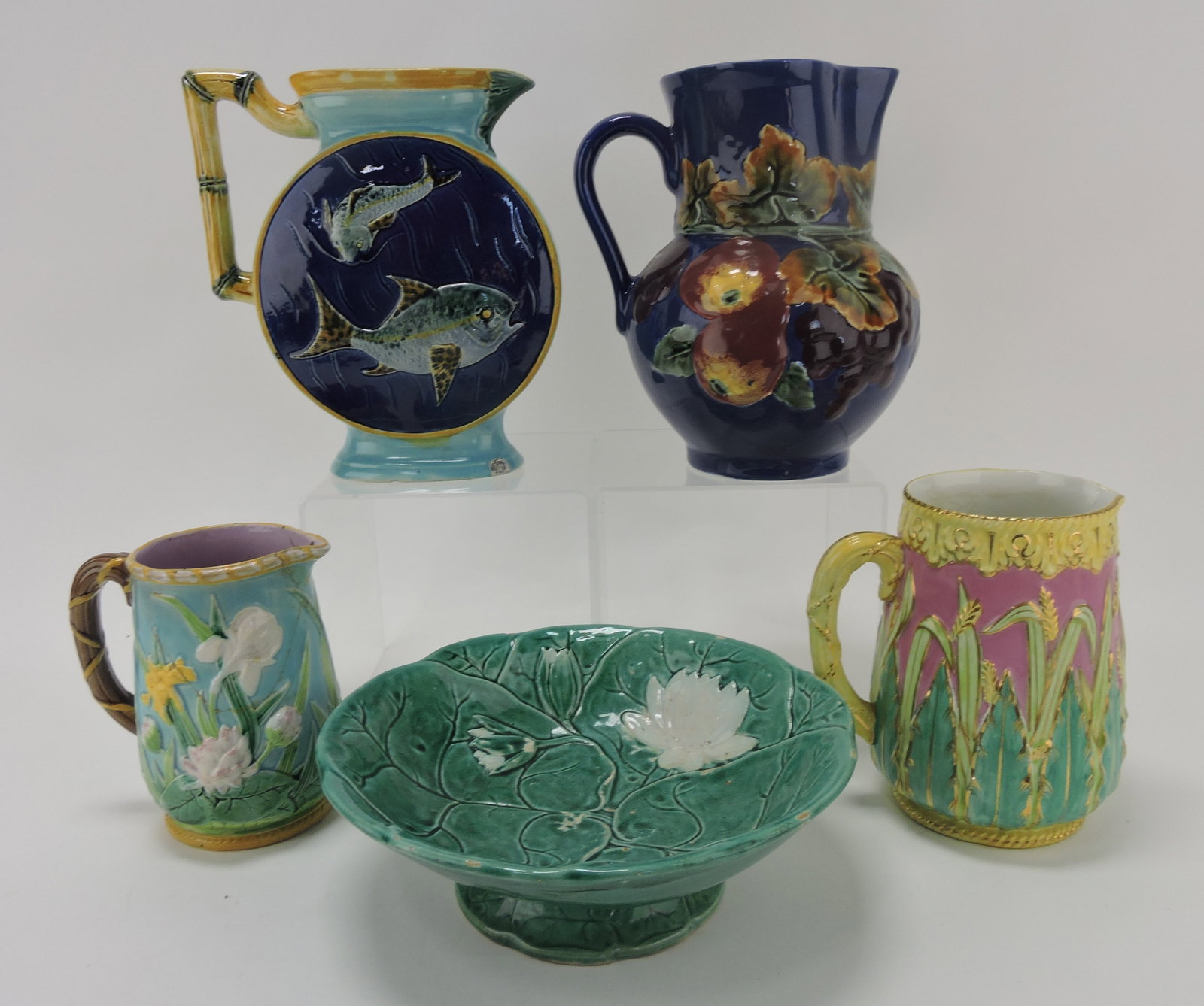 Majolica lot of 5 pcs, Holdcroft fish: pitcher (base chip), George Jones lily (repairs), 2 pitchers and Holdcroft bowl