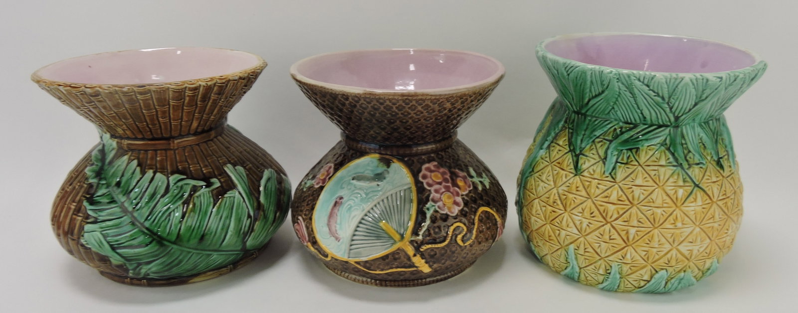 Majolica lot of 3 spittoons: bamboo and: fern (rim nicks), fan, pineapple; Joan Stacke-Graham Collection