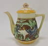 Majolica teapot with wolves and goose in