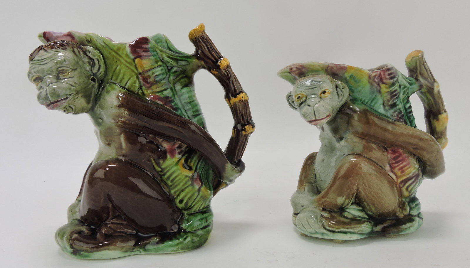 Majolica lot of 2 monkey pitchers with: bamboo handles, 7" and 6" (professional rim repair); Sue & Harry Thurmon Collection