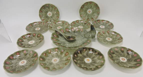 Wedgwood Argenta majolica 14 pc: ice cream set with peacock motif, to include peacock serving tray with body of a peacock forming the handle with floral tail feathers forming the bowl with serving spoon and 12 - 6 3/4" ice cream dish