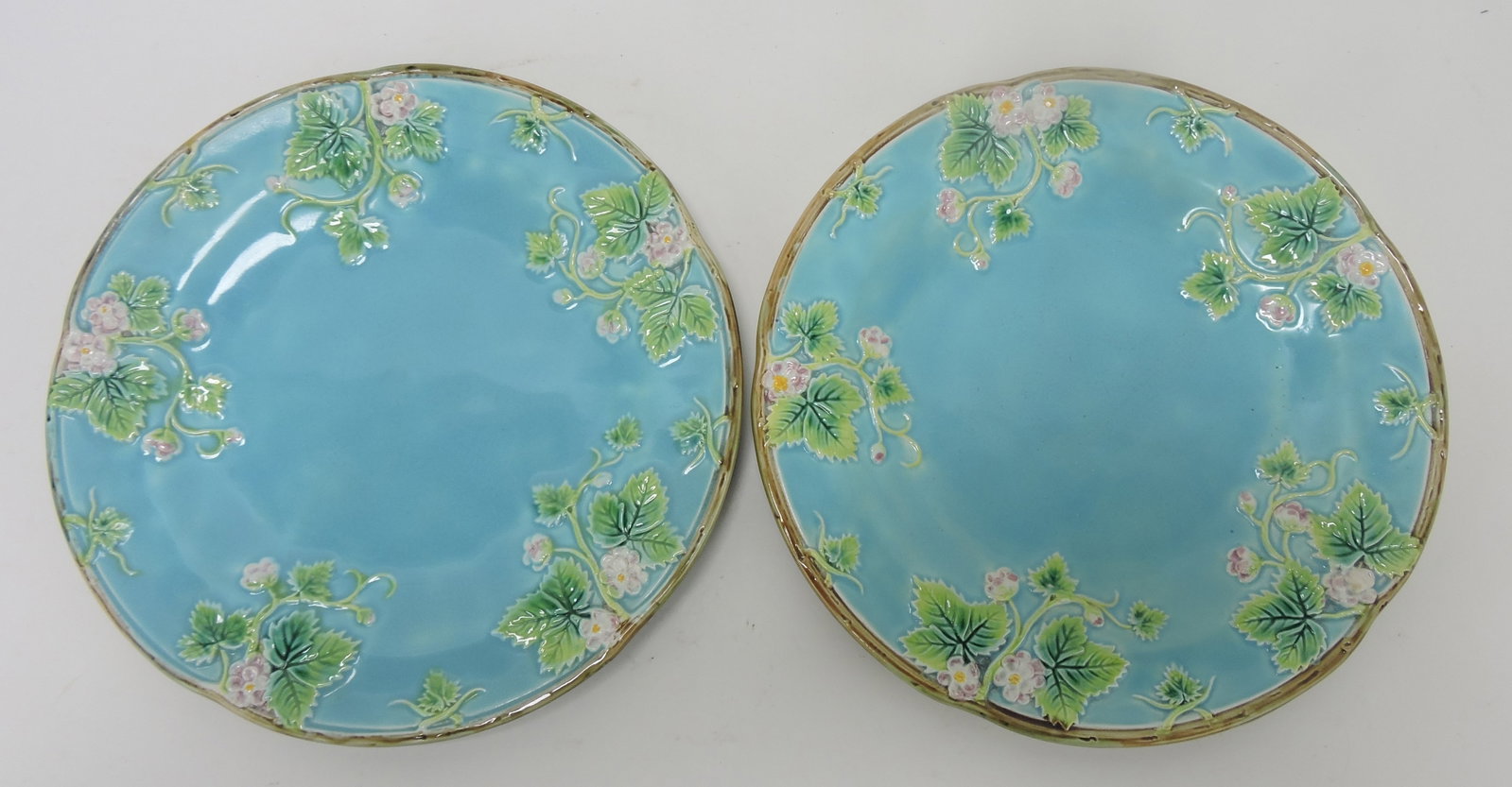George Jones majolica turquoise: pair of strawberry blossom plates, 8"; Sue & Harry Thurmon Collection