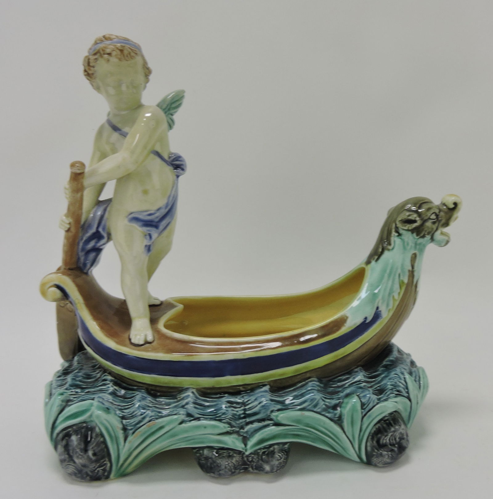 Rorstrand majolica sweetmeat dish: in form of a boat with putti, 9 1/2"h, 10"w