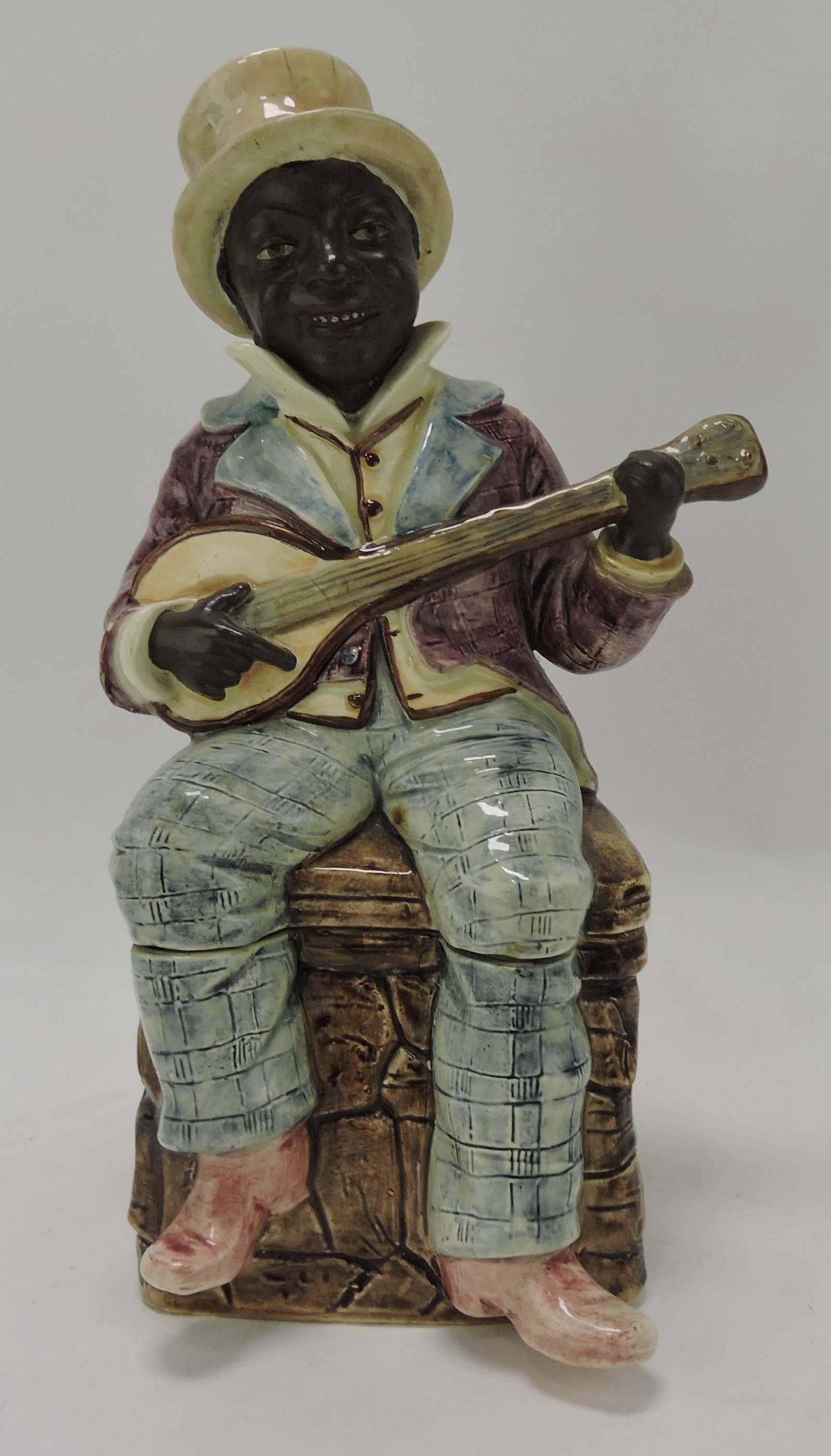 Continental majolica figural tobacco: humidor of Blackamoor with mandolin, 12"