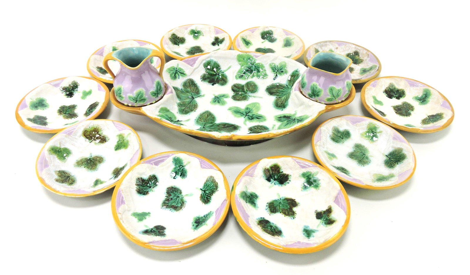 George Jones majolica strawberry: and napkin strawberry service with strawberry server with cream and sugar, 14 1/2" and 10 - 5 1/2" berry dishes, minor losses