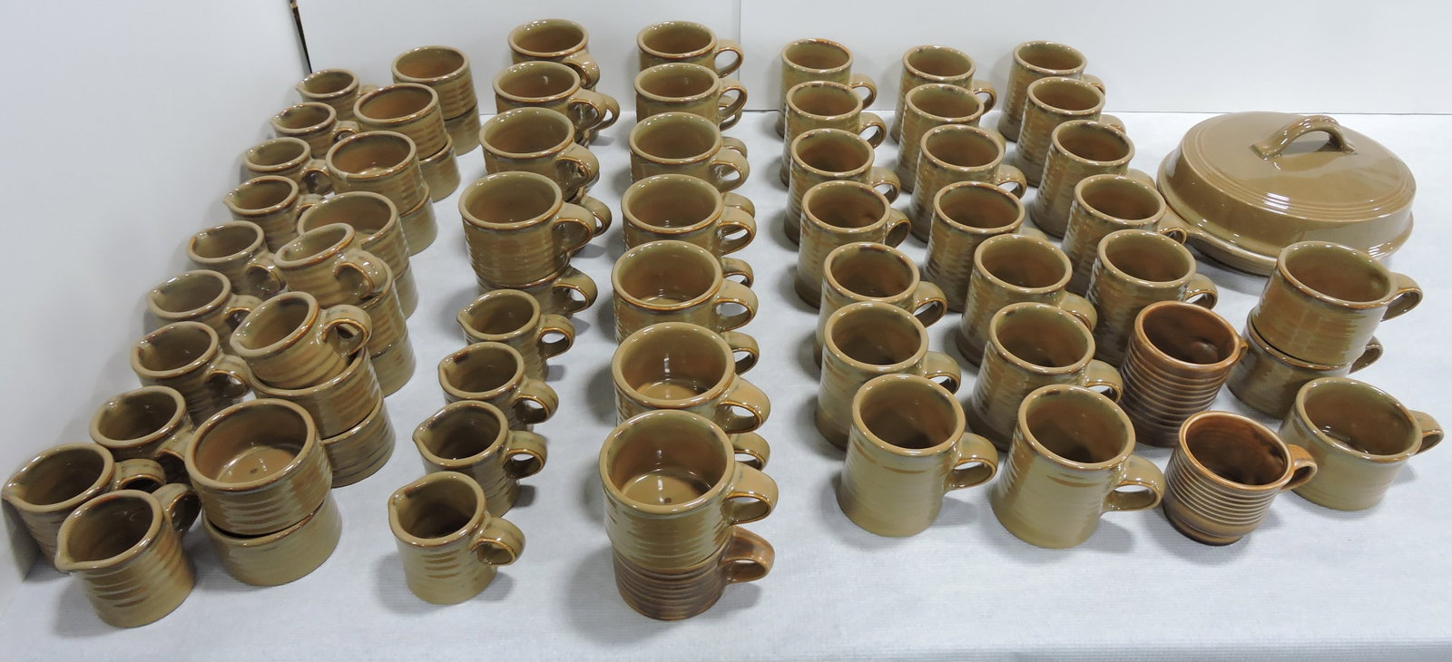 Hall China lot of assorted wares, brown: glaze, mugs, creamers, and more