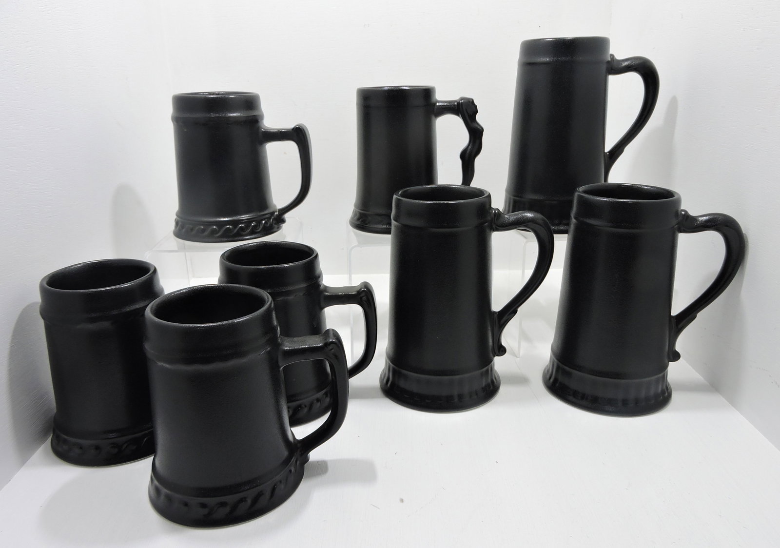 Hall China lot of 8 black mugs, one with: lady handle