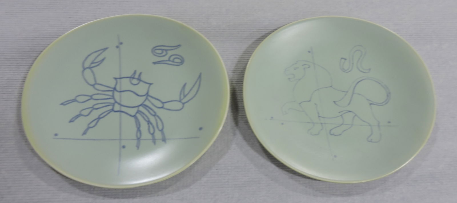 Hall China Eva Zeisel Tomorrow's: Classic pair of plates with astrology symbols, factory sample numbers on back, 8 1/2"