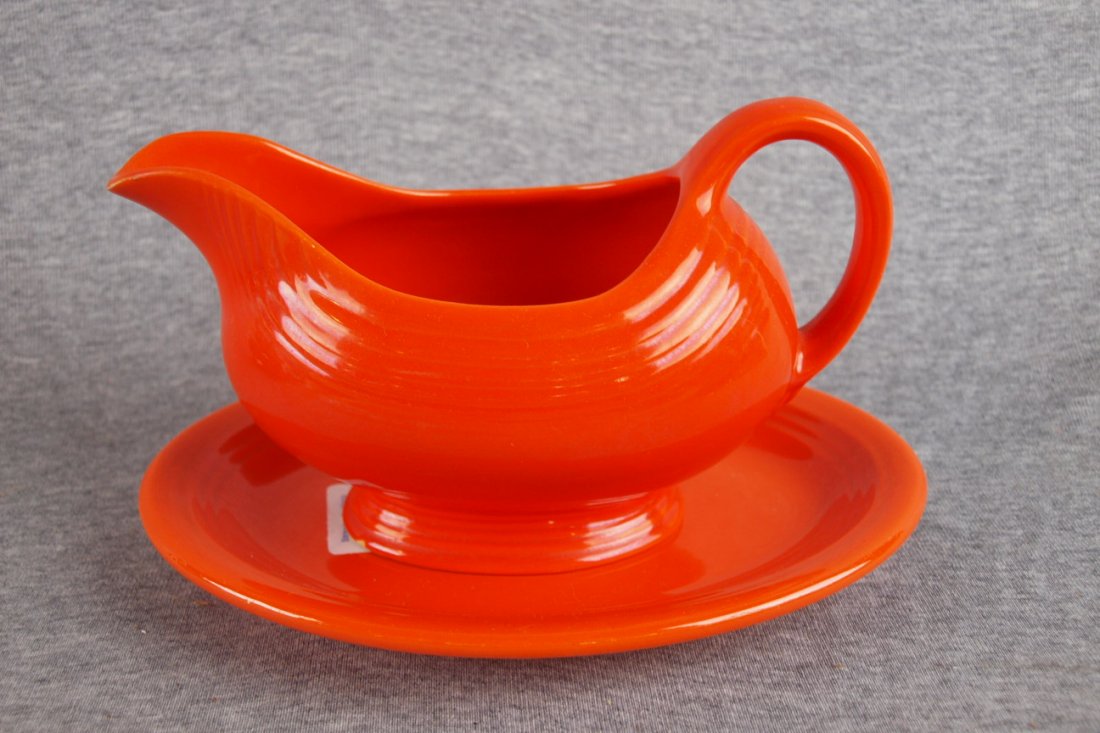 Fiesta red sauce boat and rare matching ironston: Fiesta red sauce boat and rare matching ironstone oval stand, hairline to sauce boat, wear to stand