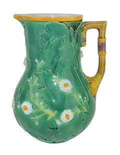 Minton Majolica Daisy Jug c.1875: 8", the body covered in large leaves and daisies, the angled handle bound with straps. Catalogued and curated by Nicolaus Boston. Flower Family Collection