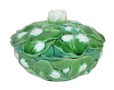 Minton Majolica water lily Butter Dish: c.1865, 4"h, 6 1/2"d, shape no. 887, the round bowl and cover covered with plump lily leaves and heads, a lily head forming the handle. Catalogued and curated by Nicolaus Boston. Flower Family