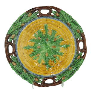 Minton Majolica Bread Tray c.1865,: 13 1/2", the circular body with a central panel of basket weave with radiating pine leaves and cones from the centre with a rope twist border, wide outside border of open branch work to form handles,