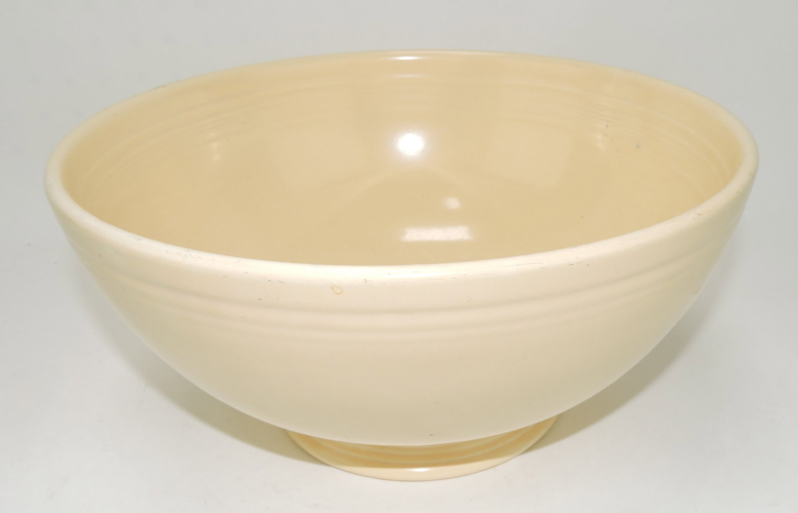 Fiesta footed salad bowl, ivory,: kiln burr