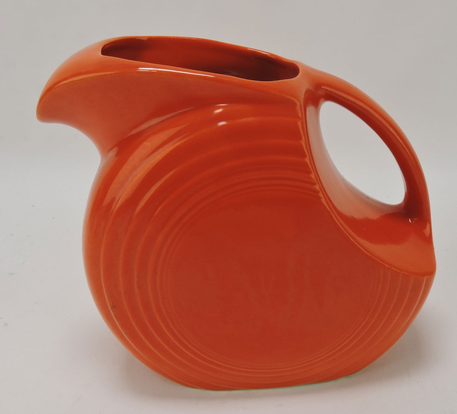 Fiesta disc water pitcher, red, minor (1 of 1)