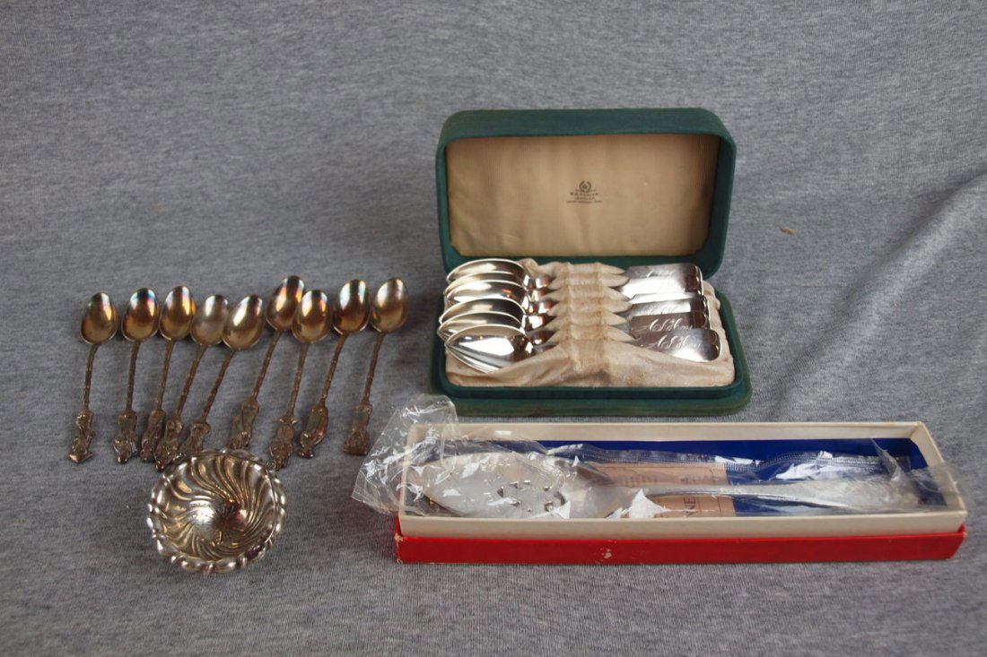 Set of N. Matson coin silver spoons in fitted case,: Set of N. Matson coin silver spoons in fitted case, set of 10 demitasse spoons with Asian people on handles, Tiffany & Co. sterling tea strainer