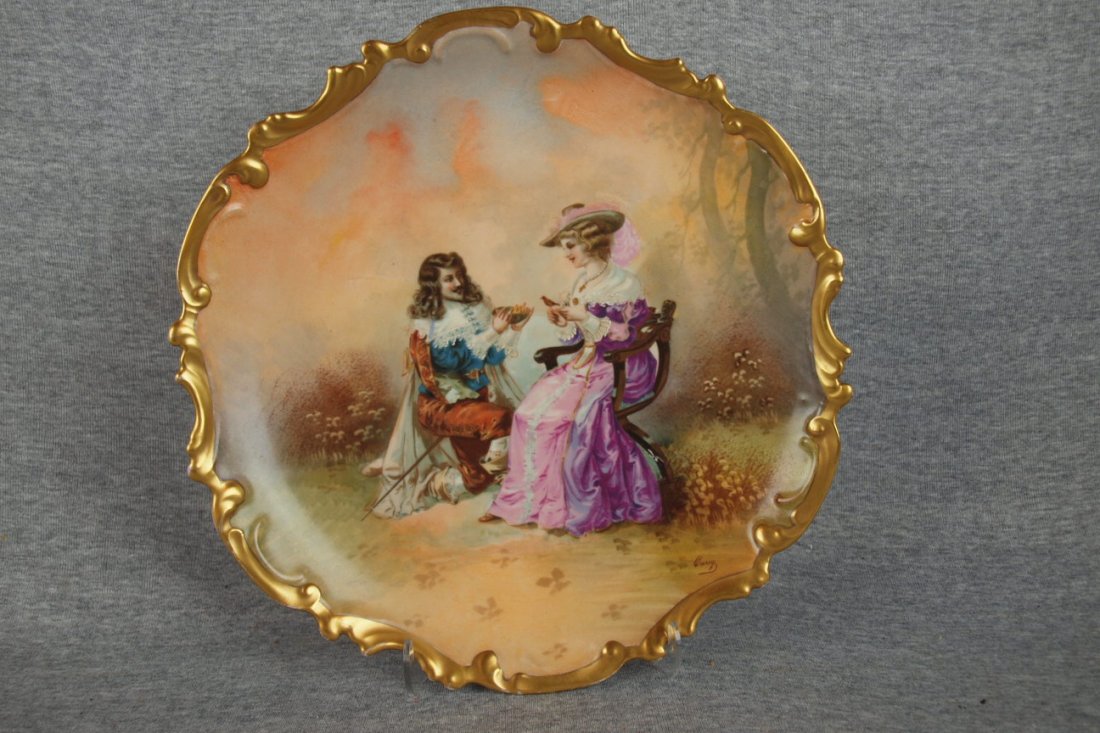 Limoges charger with man and lady with bird and b: Limoges charger with man and lady with bird and bird's nest, 12"