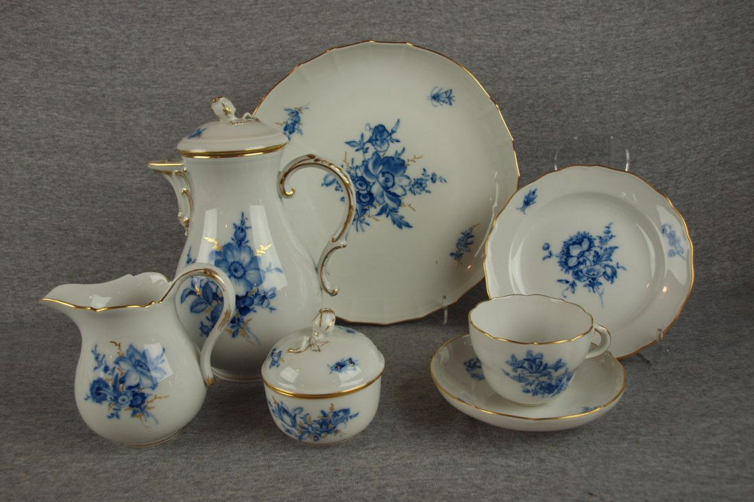 Meissen signed dessert/tea set with teapot, cream: Meissen signed dessert/tea set with teapot, cream, sugar, 11" cake plate, 12-7" plates, 12 cups (one chipped) and 11 saucers withblue floral motif with gold accent, 39 pieces, minor nick to finial of
