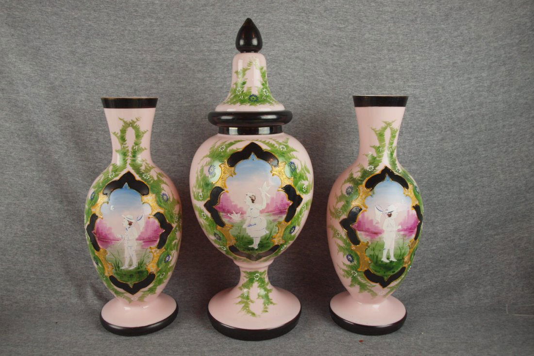 Bristol glass 3 piece garniture set with tall cov: Bristol glass 3 piece garniture set with tall covered urn with enamel scene of girl with birds 19" and pair of 14 1/2" vases enameled with boys catching butterflies