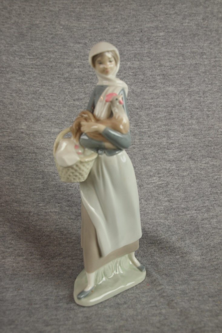 Lladro figure of lady with chicken and basket of : Lladro figure of lady with chicken and basket of eggs, 9 1/2"