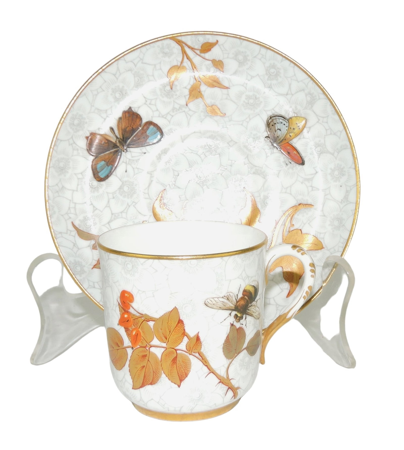 Royal Worcester Porcelain Aesthetic: Movement Cup and Saucer c.1880, the bodies in grey hawthorn pattern decorated with enamelled butterflies and bees and 22ct gilded leaves Catalogued and curated by Nicolaus Boston