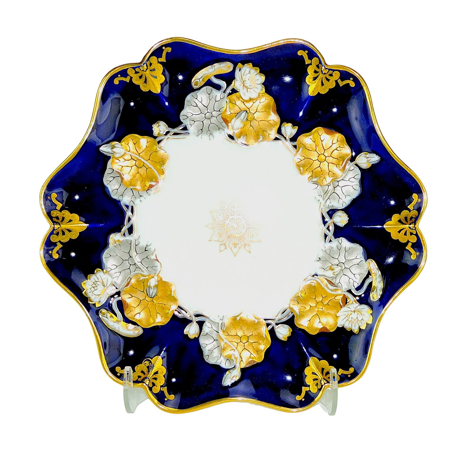 Coalport Porcelain Aesthetic Movement: Dish c.1880, the shaped white ground body with a broad border decorated with 22ct gilded and platinum lotus leaves; 9 1/2" Catalogued and curated by Nicolaus Boston