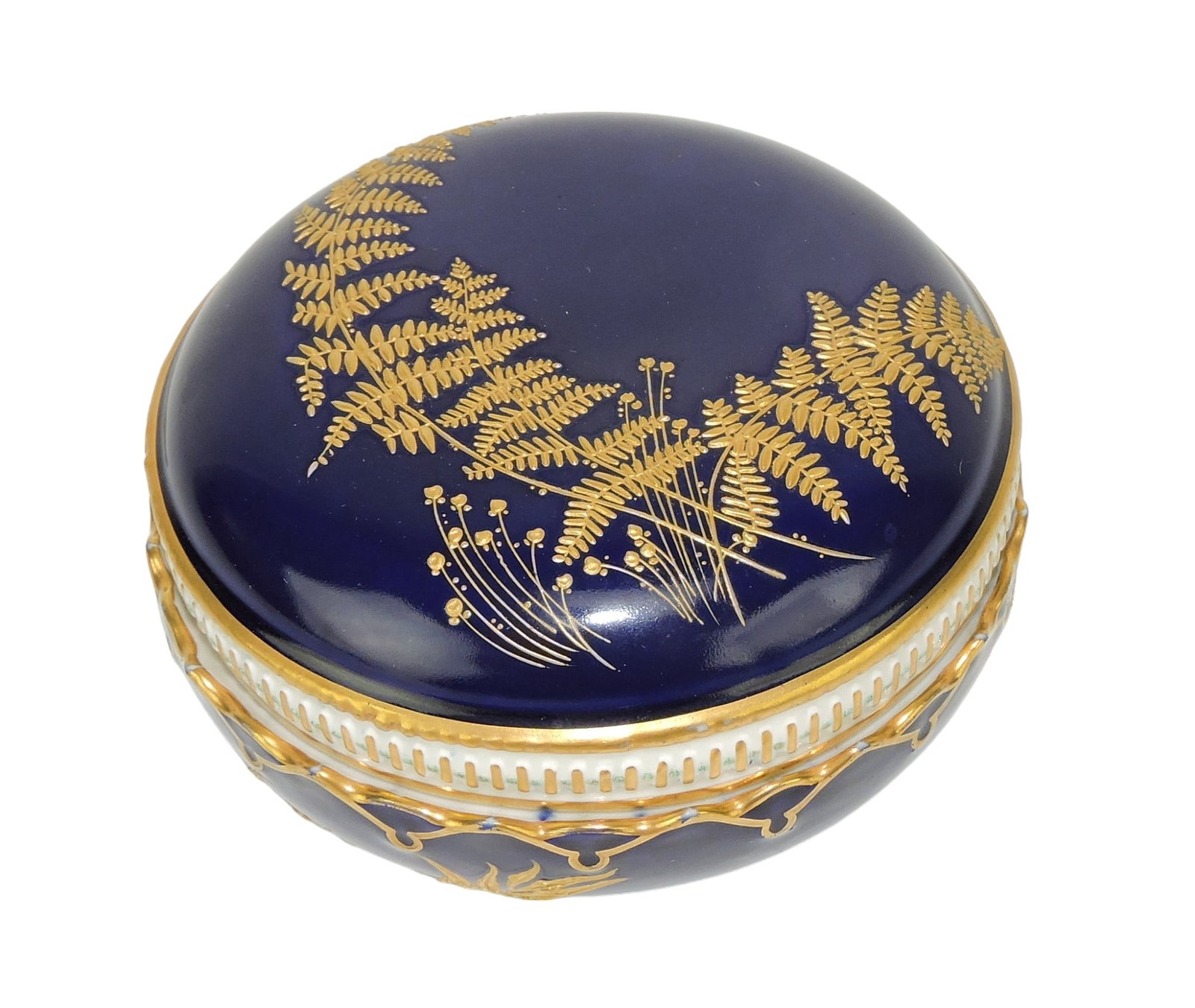Royal Worcester Aesthetic Movement: Box and Cover with a cobalt blue body, lid decorated with 22ct gilded ferns; 2 1/4"h, 4 1/4"d Catalogued and curated by Nicolaus Boston