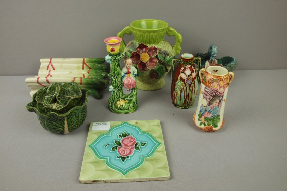 Majolica lot of 8 assorted pieces - tile, aspargus: Majolica lot of 8 assorted pieces - tile, aspargus cradle, 3 vases, candle holder, basket and sugar, various condition