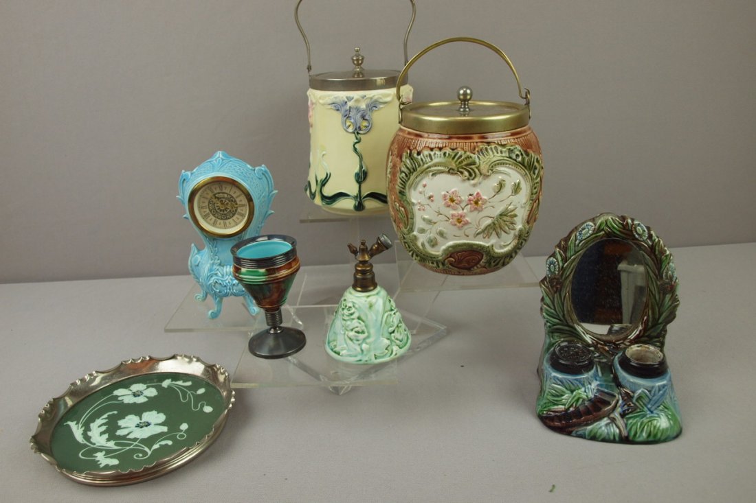 Majolica lot of assorted items - 2 cracker jars, : Majolica lot of assorted items - 2 cracker jars, inkwell, clock, Wedgwood egg cup, perfume bottle and silver rimmed tray, 7 pieces