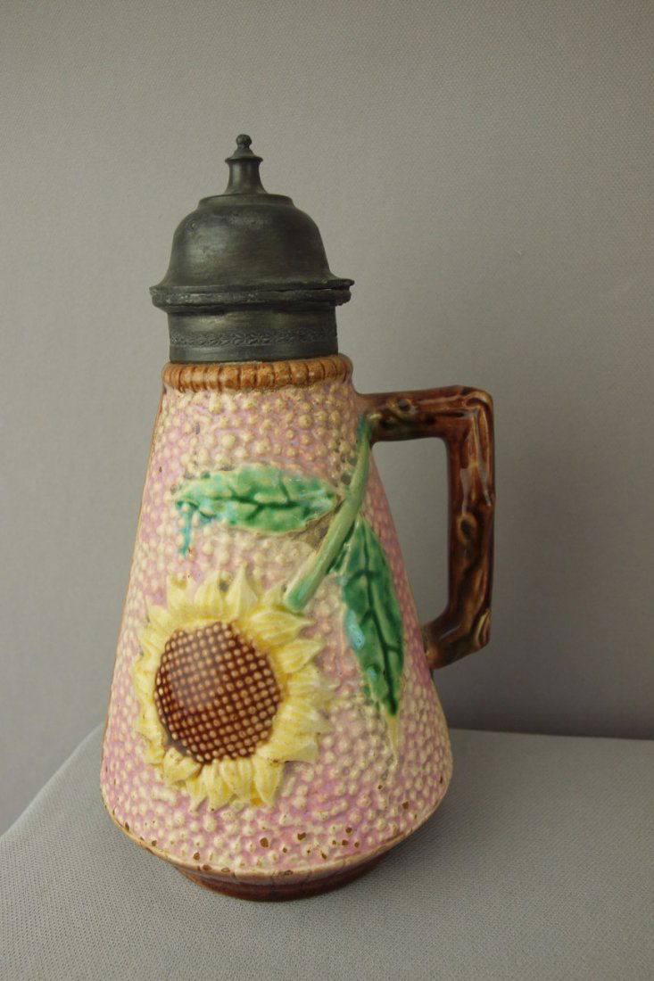 ETRUSCAN pink majolica sunflower syrup pitcher wi: ETRUSCAN pink majolica sunflower syrup pitcher with pewter top, top needs reattached at hinge, surface wear, 8"