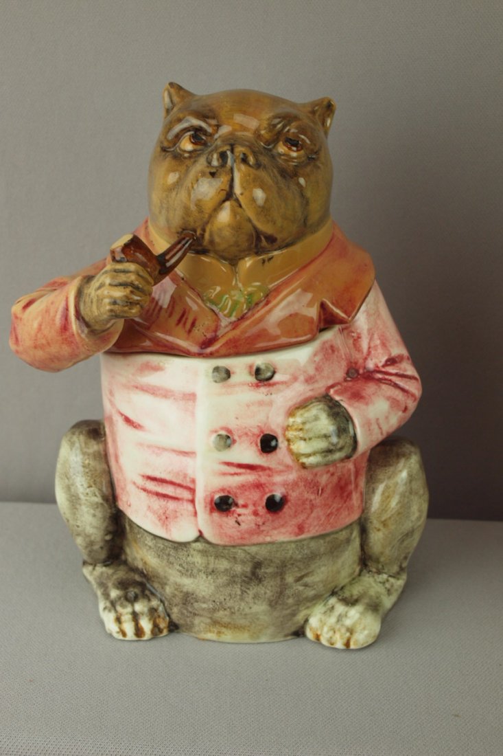 Continental majolica bulldog tobacco jar with red: Continental majolica bulldog tobacco jar with red smoking jacket and pipe, lid discolored, 8"