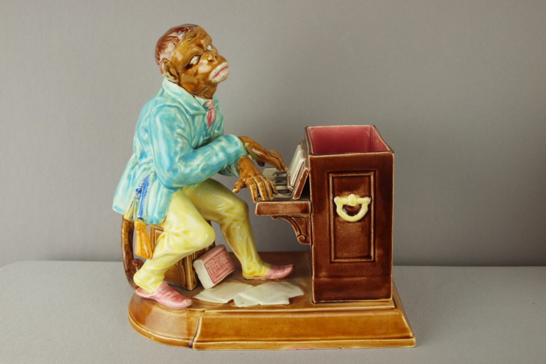 SARREGUEMINES majolica humidor in the form of a m: SARREGUEMINES majolica humidor in the form of a monkey playing an organ, loss of lid, professional repair to tail, 9 1/2"h