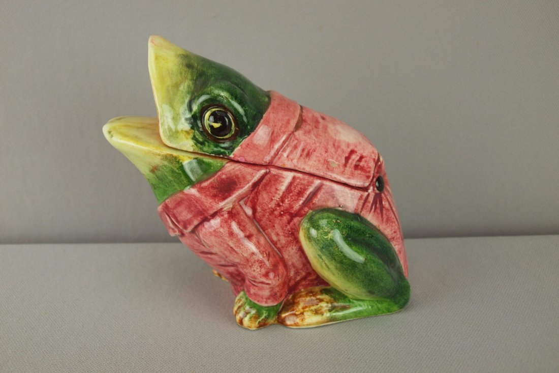 Continental crouching frog humidor with red smoki: Continental crouching frog humidor with red smoking jacket, minor nicks to lid, 5 3/4"h