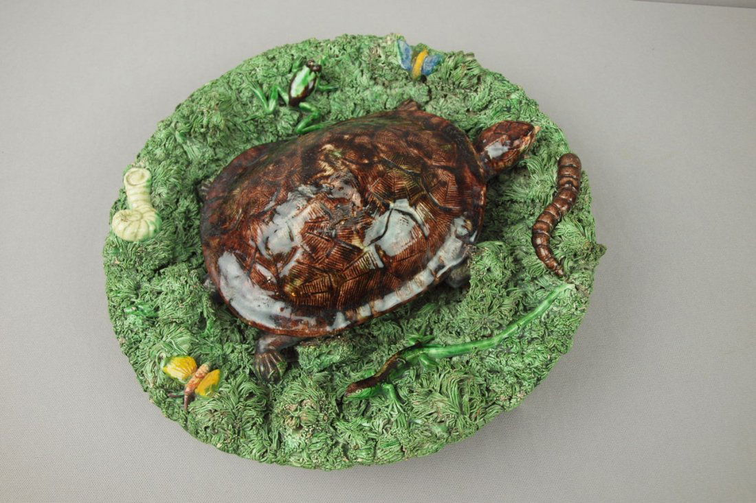Jose Cunha Portugal Palissy Ware rare majolica ro: Jose Cunha Portugal Palissy Ware rare majolica round charger with large turtle in center with frog and other sea creatures on heavy green grass ground, very rare form, 12 1/2", minor losses to tips of