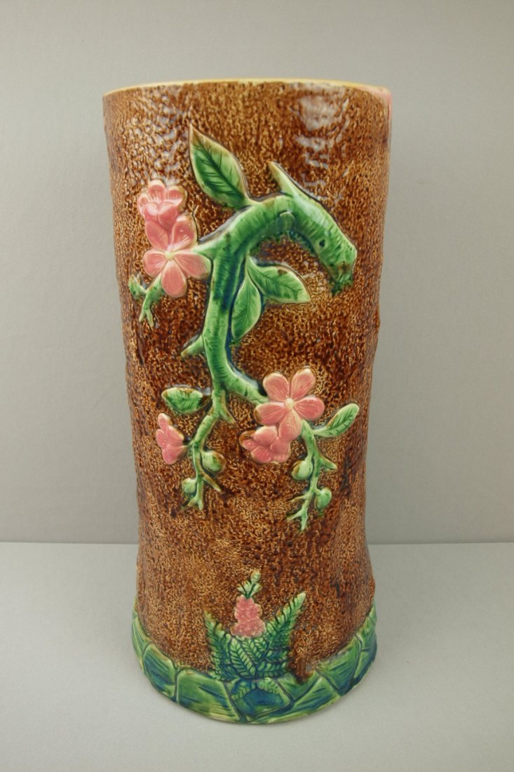 Majolica rustic umbrella stand in the form of a t: Majolica rustic umbrella stand in the form of a tree trunkwith flowers and ferns, 21, hairline