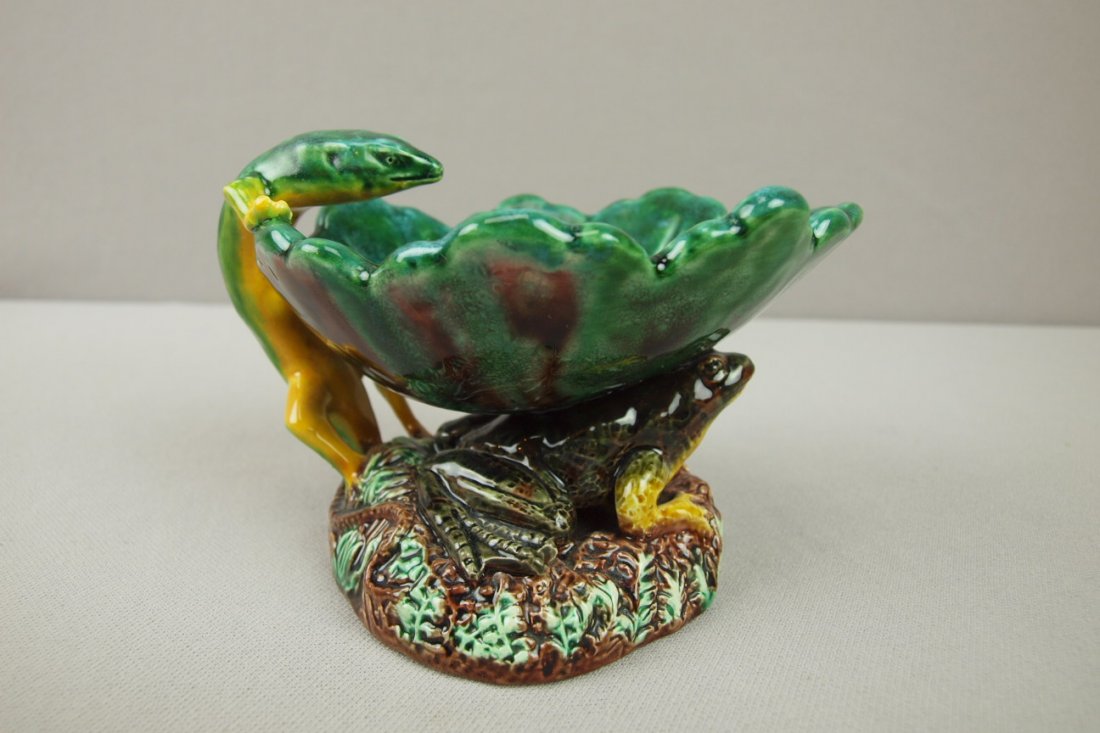 GEORGE JONES rare majolica figural dish in the fo: GEORGE JONES rare majolica figural dish in the form of a leaf atop a frog with a salamander handle, professional rim and handle repair, very rare form, 4"h