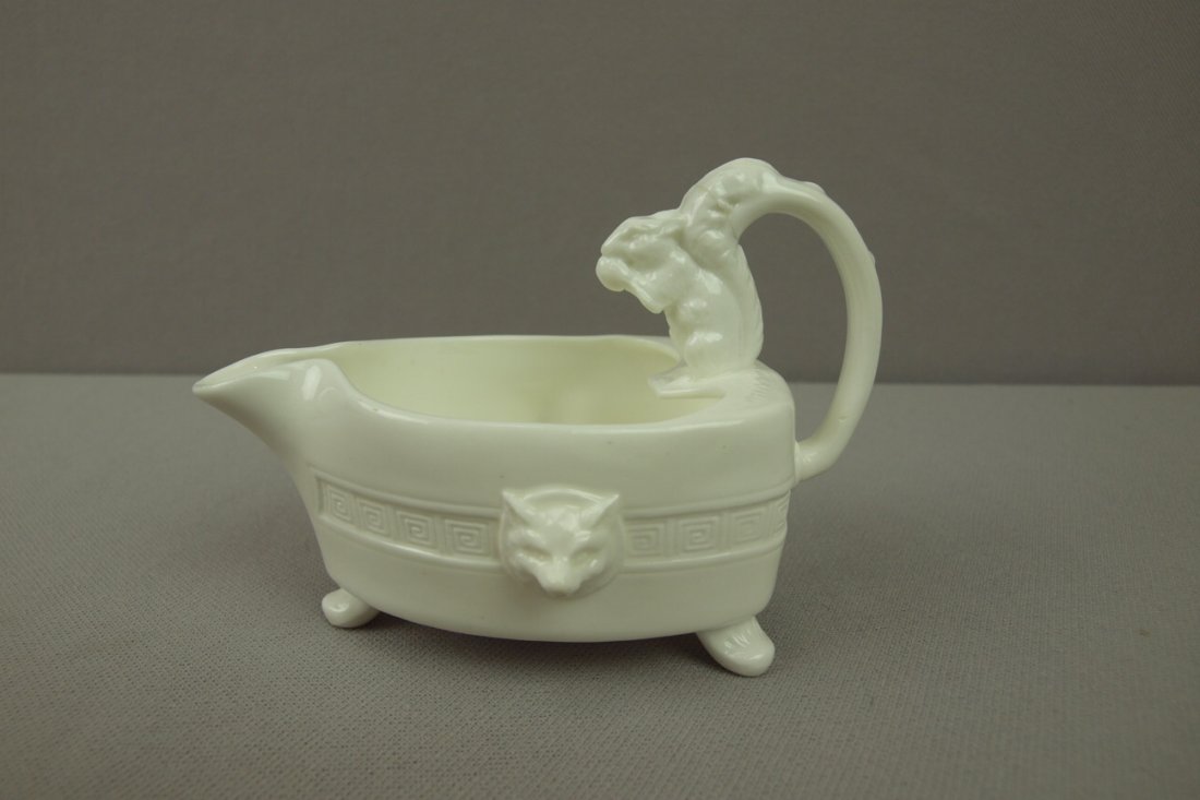 MINTON majolica white creamer with squirrel handl: MINTON majolica white creamer with squirrel handle and fox heads on each side, this creamer is mate the the rare Minton "Flat Iron" teapot made in both majolica glazes and white, very rare, 3"