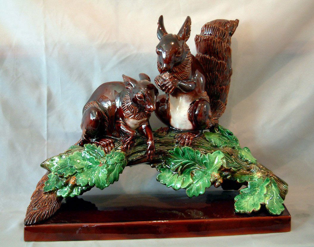 HUGO LONITZ rare monumental majolica squirrels ce: HUGO LONITZ rare monumental majolica squirrels centre, 22" long with two squirrels sitting on anoak branch with acorn and leaf detail