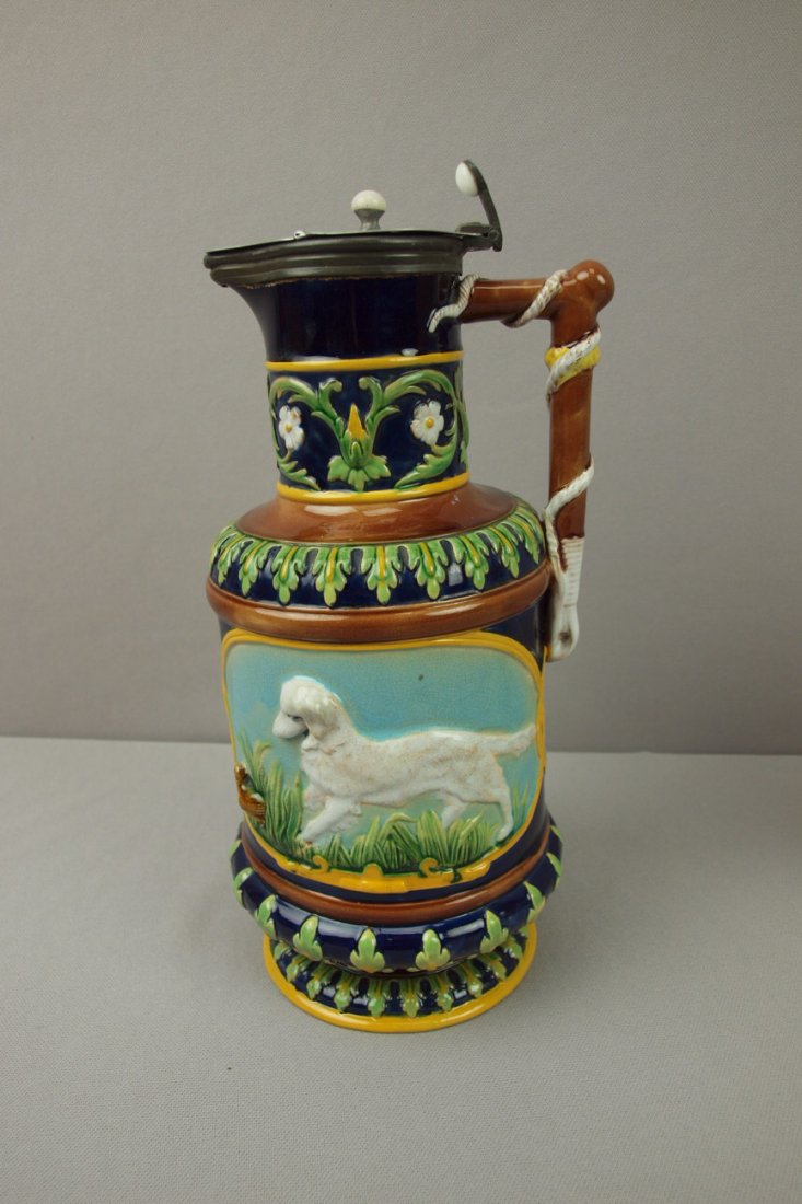 GEORGE JONES cobalt majolica hunt jug with bird d: GEORGE JONES cobalt majolica hunt jug with bird dog and bird on one side and fox and rabbit on the other, pewter top, 10"h, professional repair to base rim