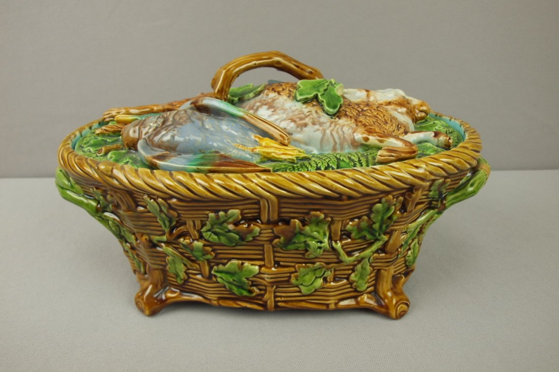 MINTON majolica game dish with dead game on cover: MINTON majolica game dish with dead game on cover of basket base with oak leaves and acorns, 13 1/2"l, professional hairline repair to base