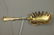 725: Sterling silver fried oyster server with gold was