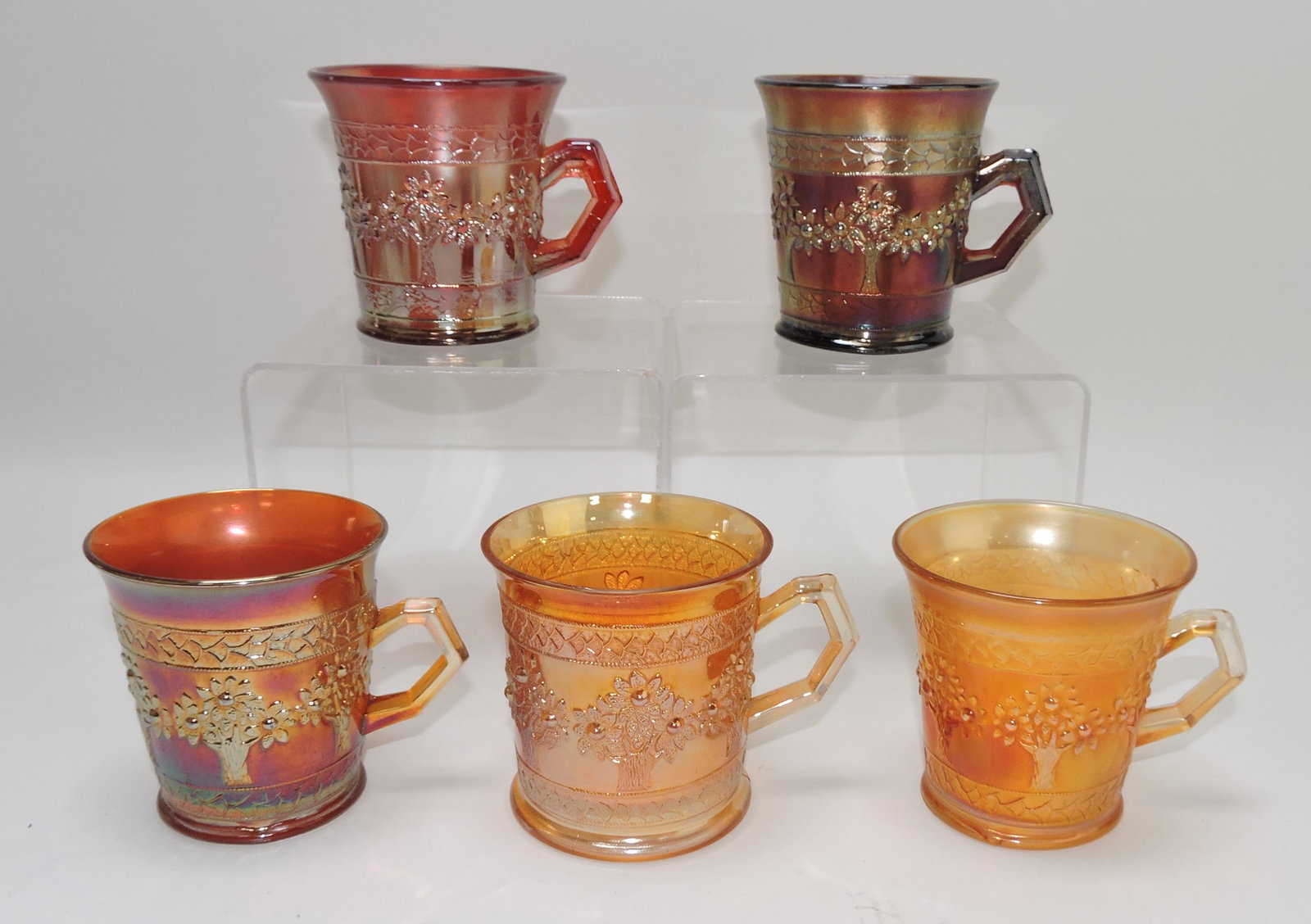Fenton carnival glass Orange Tree: mugs, 4 marigold, 1 red