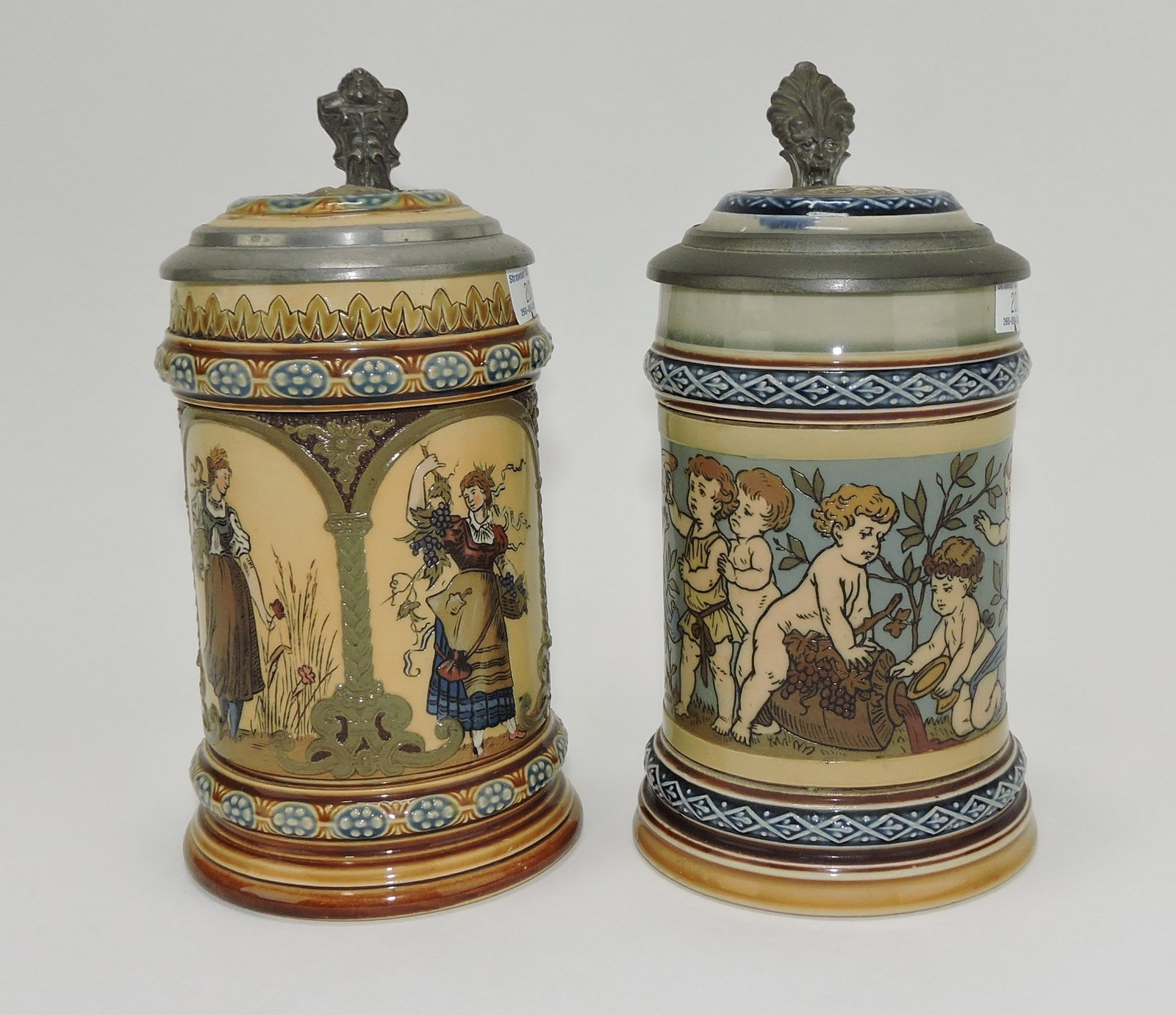 Mettlach lot of 2 steins #1972 1/4L,: women/four seasons AND #2121 1/4L, cherubs