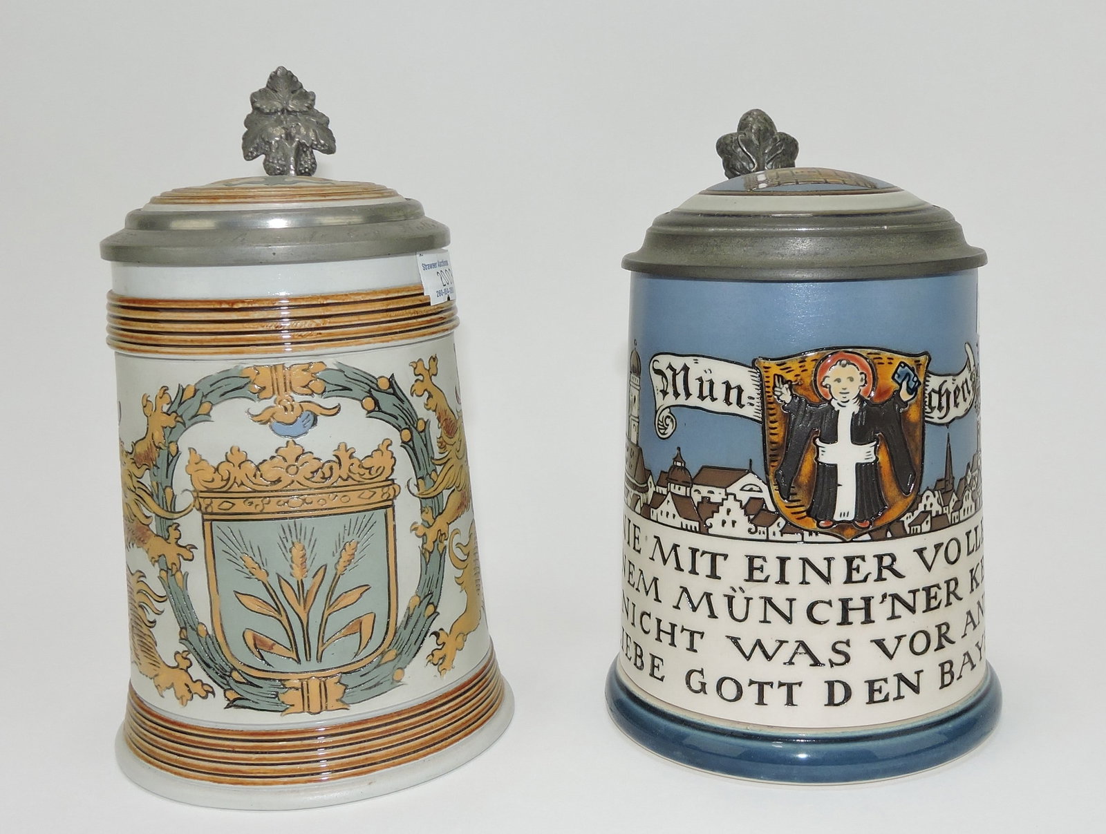 Mettlach lot of 2 steins, #1532 1/2L,: shield and lions AND #2002 1/2L, Munchen child