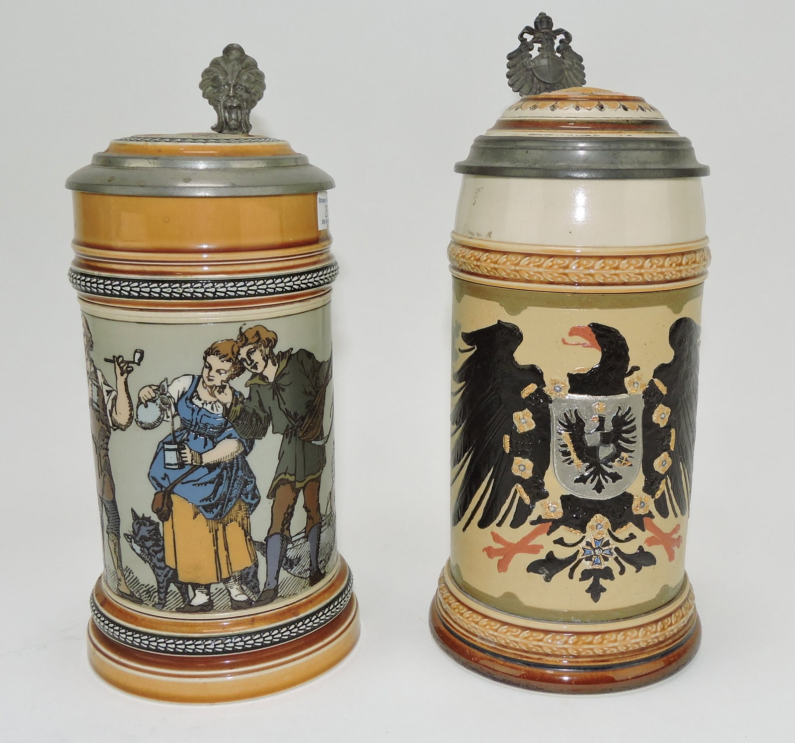 Mettlach lot of 2 steins, #1164 1/2L,: indoor scene AND #2204 1/2L. eagle